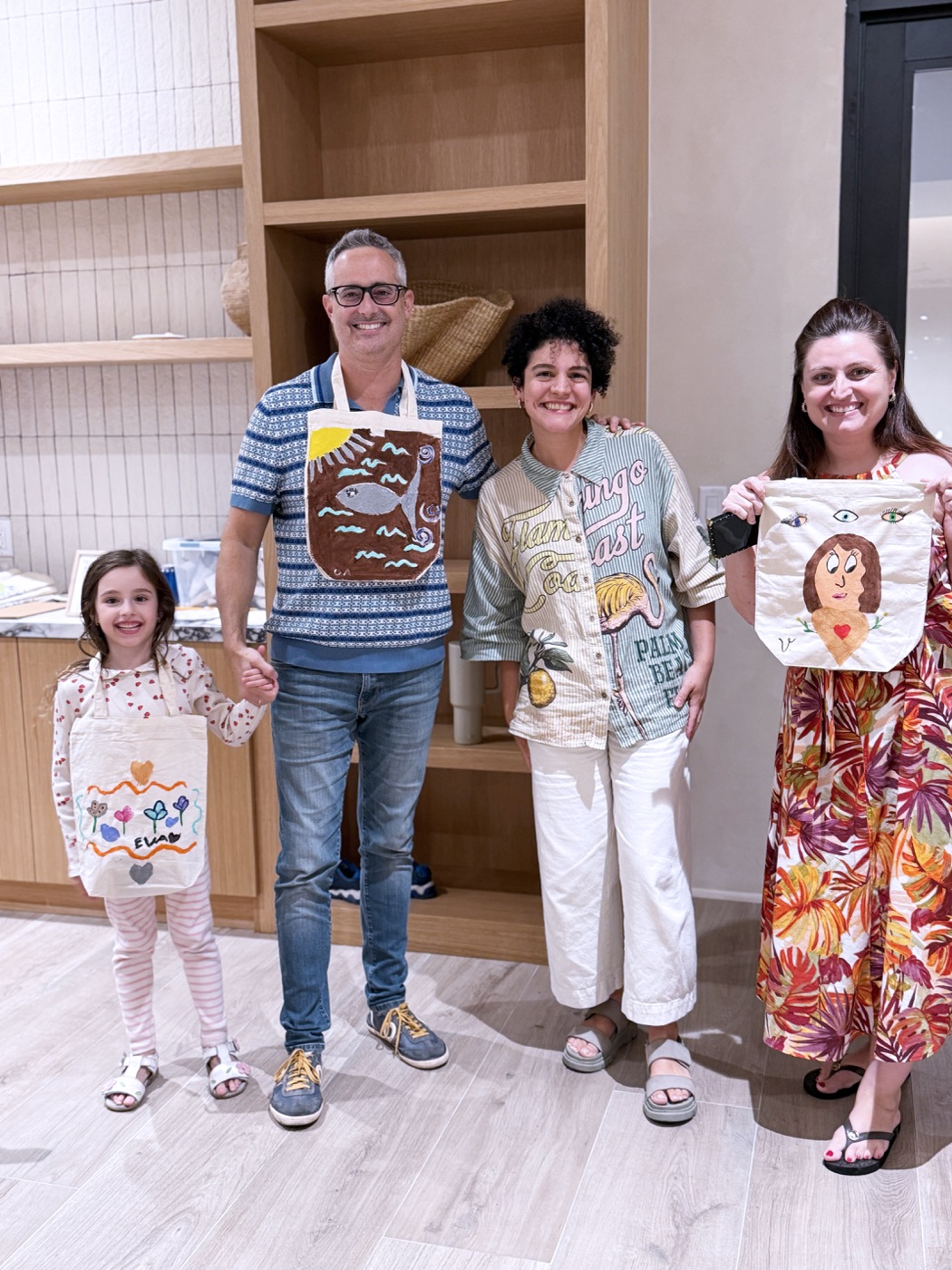 Families with their painted tote bags